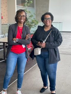 Adria Jackson, left, stands next to a Paragon Bank colleague. 